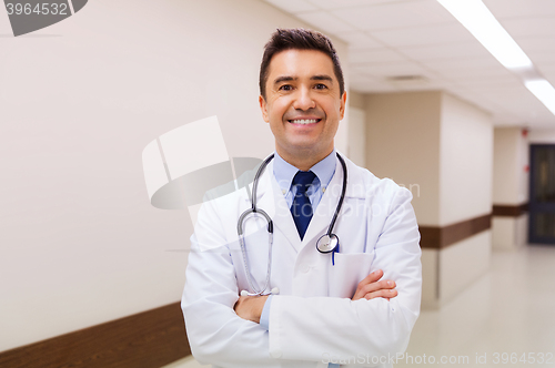 Image of smiling doctor in white coat at hospital