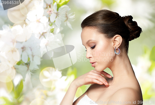 Image of close up of beautiful woman face with earring