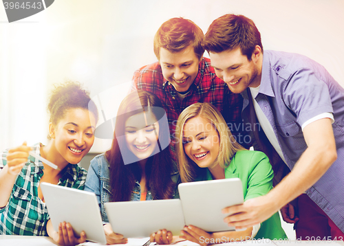 Image of students looking at tablet pc in lecture at school