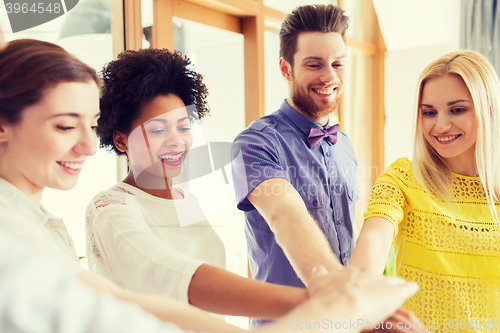 Image of happy creative team in office