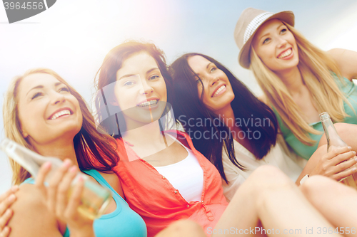 Image of girls with drinks on the beach