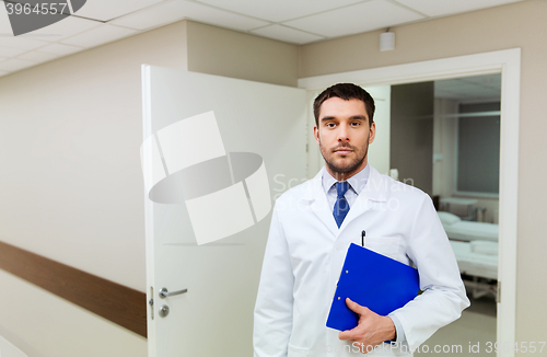 Image of doctor with clipboard at hospital
