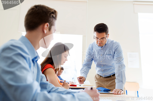 Image of group of students and teacher at school classroom