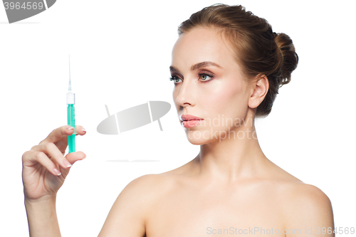 Image of beautiful woman holding syringe with injection