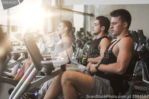 Image of men working out on exercise bike in gym