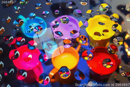 Image of Colorful abstract background through drops