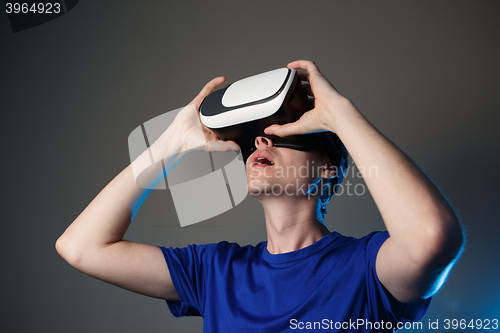 Image of Man wearing virtual reality goggles.