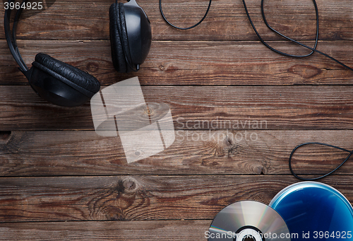 Image of top view of music cd player equipment on wooden desk