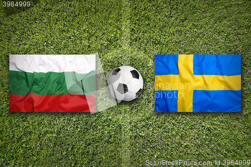 Image of Bulgaria vs. Sweden flags on soccer field