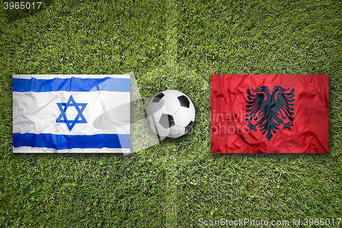 Image of Israel vs. Albania flags on soccer field