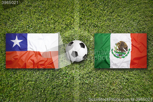 Image of Chile vs. Mexico flags on soccer field