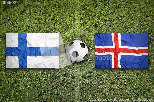 Image of Finland vs. Iceland flags on soccer field