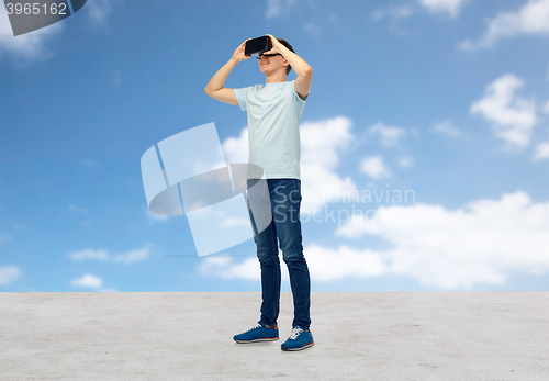 Image of happy man in virtual reality headset or 3d glasses