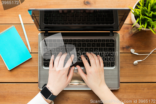 Image of close up of woman or student typing on laptop