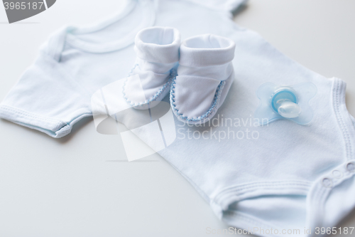 Image of close up of baby boys clothes for newborn on table