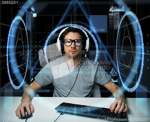 Image of man in headset with computer virtual projections