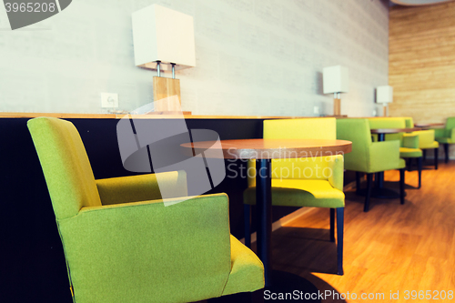 Image of restaurant interior with tables and chairs