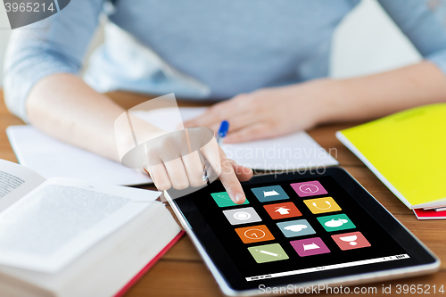 Image of close up of student with menu icons on tablet pc