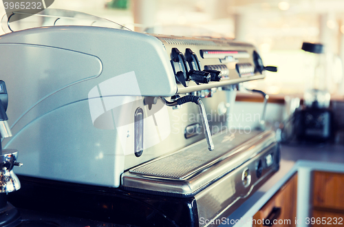 Image of close up of coffee machine at bar or restaurant