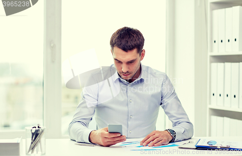 Image of close up of businessman with smartphone