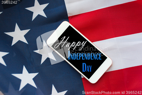 Image of close up of cellphone on american independence day