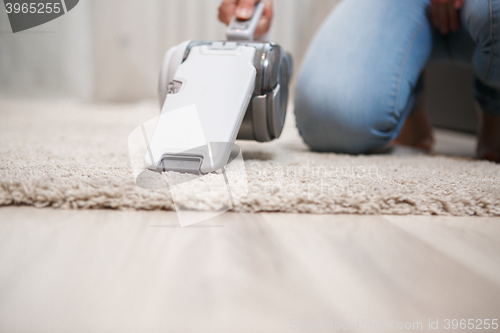 Image of Closeup white cordless handheld vacuum cleaner