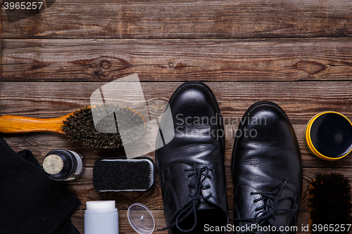 Image of Shoe wax, brush and boot