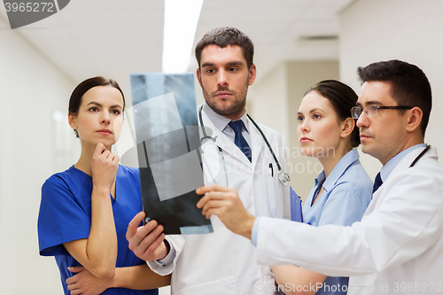 Image of group of medics with spine x-ray scan at hospital