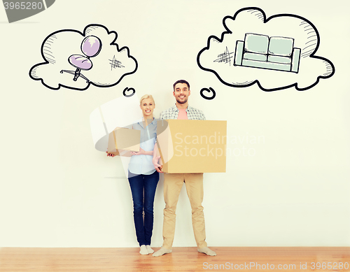 Image of couple with cardboard boxes moving to new home