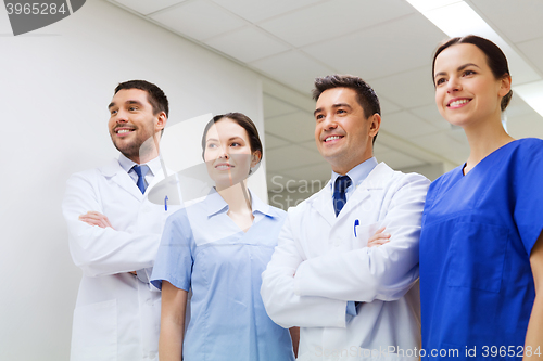 Image of group of happy medics or doctors at hospital