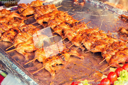 Image of chicken grill at street market