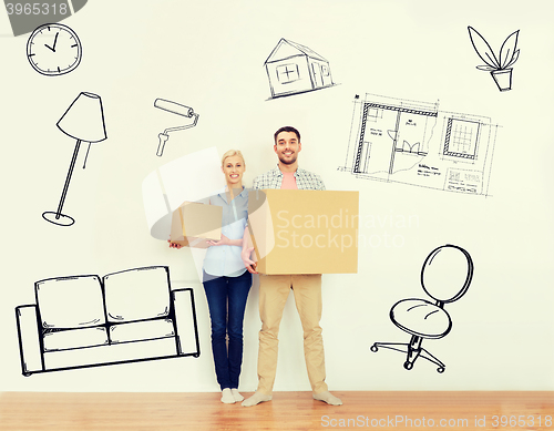 Image of couple with cardboard boxes moving to new home