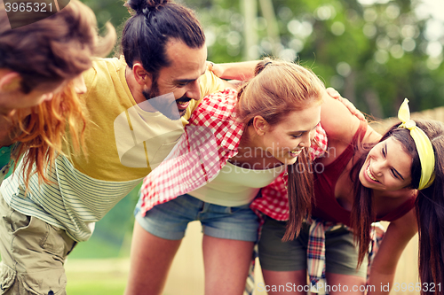 Image of group of smiling friends outdoors