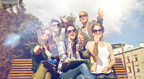 Image of group of students or teenagers showing thumbs up