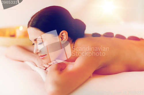 Image of woman in spa with hot stones