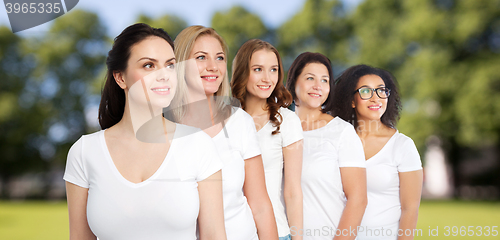 Image of group of happy different women in white t-shirts