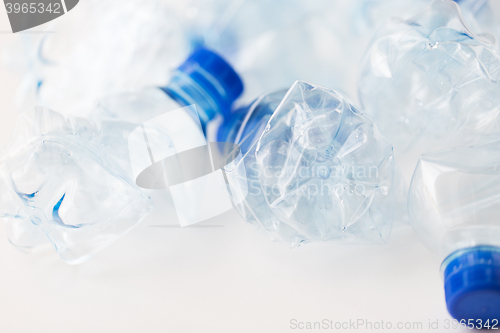 Image of close up of empty used plastic bottles on table