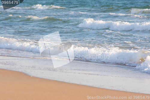 Image of Sea surf on a sandy beach