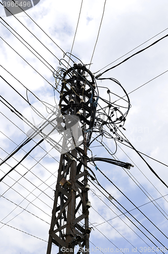 Image of Many wires on an old electric pole