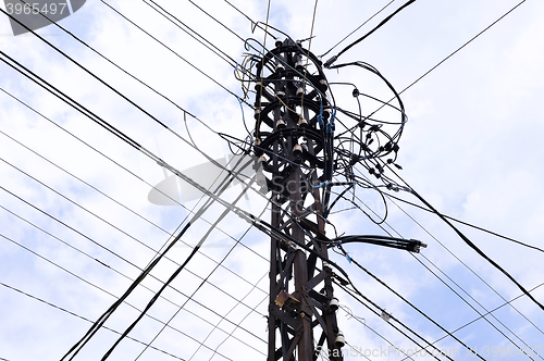 Image of Many wires on an old electric pole