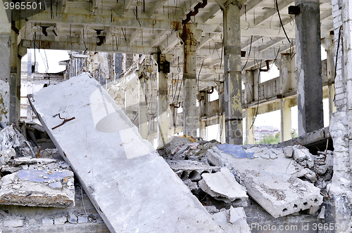 Image of Pieces of Metal and Stone are Crumbling from Demolished Building Floors