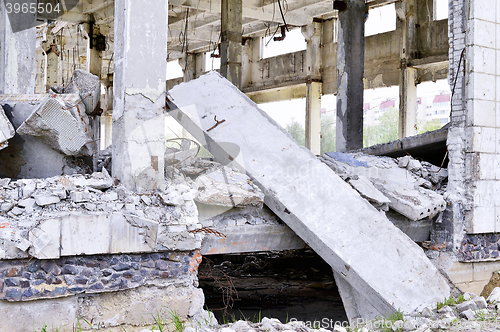 Image of Pieces of Metal and Stone are Crumbling from Demolished Building Floors