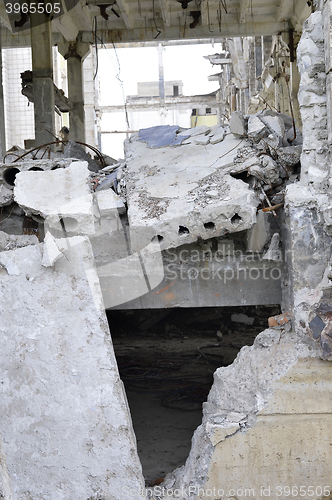 Image of Pieces of Metal and Stone are Crumbling from Demolished Building Floors