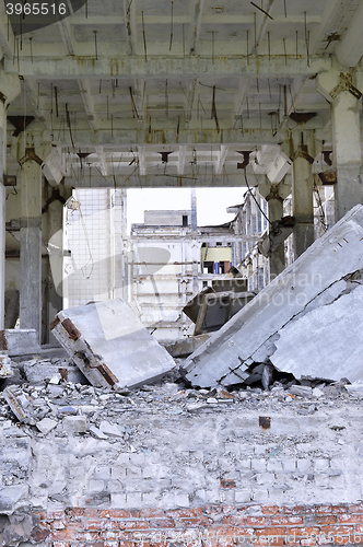 Image of Pieces of Metal and Stone are Crumbling from Demolished Building Floors