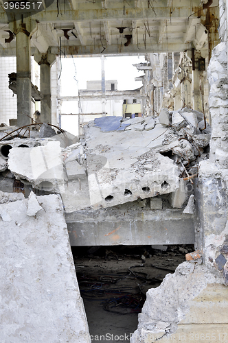 Image of Pieces of Metal and Stone are Crumbling from Demolished Building Floors