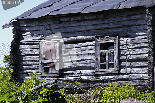 Image of Old abandoned wooden farmhouse closeup