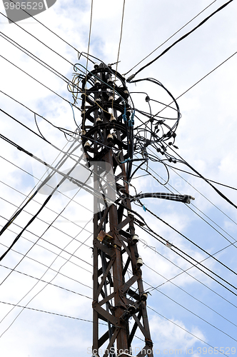 Image of Many wires on an old electric pole