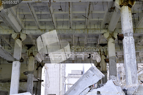 Image of Pieces of Metal and Stone are Crumbling from Demolished Building Floors