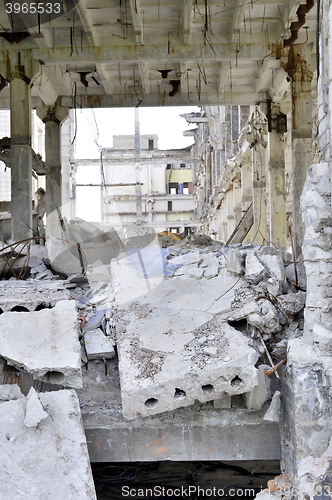 Image of Pieces of Metal and Stone are Crumbling from Demolished Building Floors