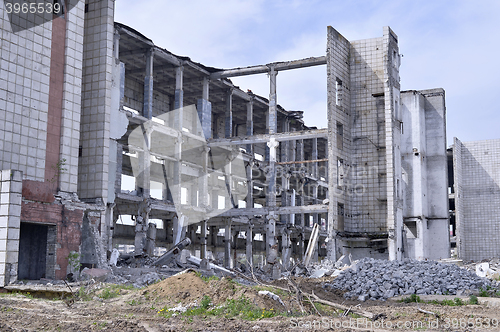 Image of Pieces of Metal and Stone are Crumbling from Demolished Building Floors